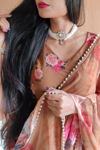 Elegance Redefined Georgette Printed Saree with Pearl Lace